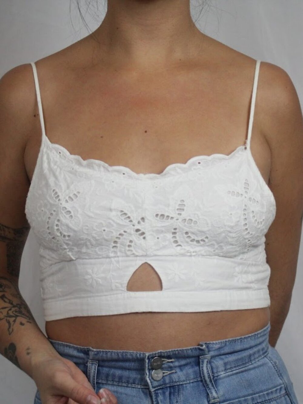 Ganji crop top with floral lace detail and cutout